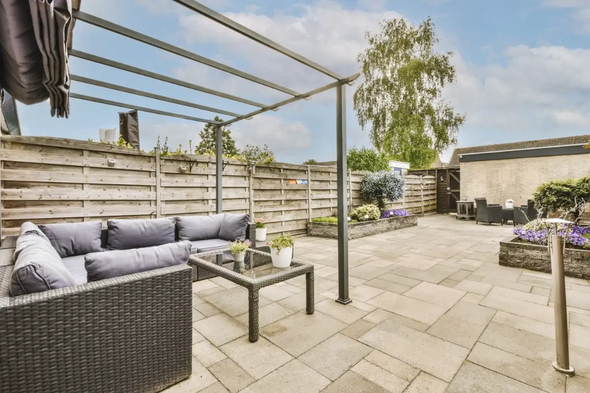Patio installation with paving slabs and modern garden seating area