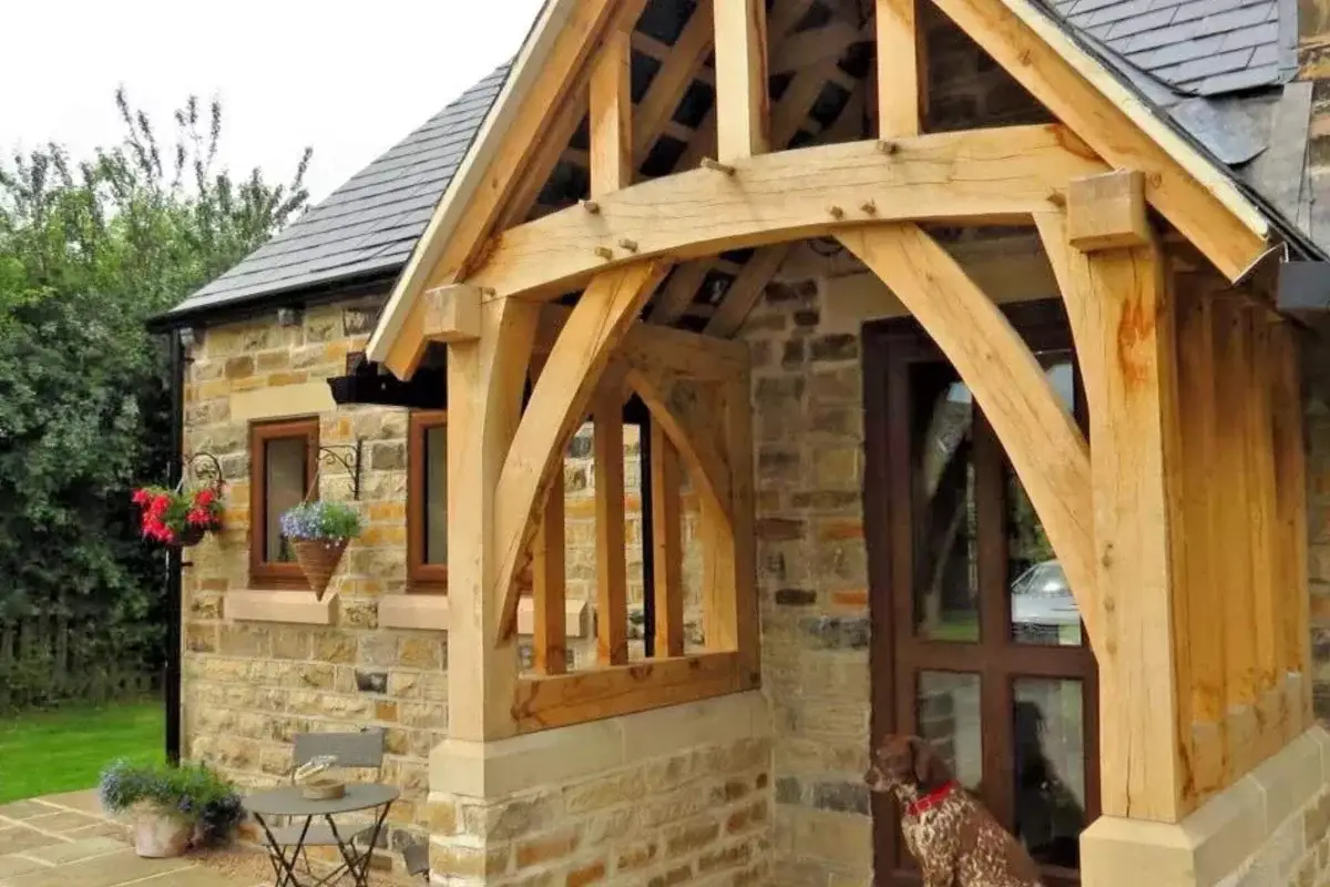 Oak framed porch extension on a traditional stone cottage